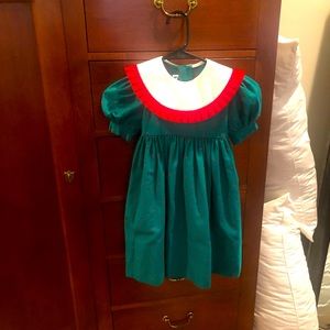 Monday’s Child green and red dress.